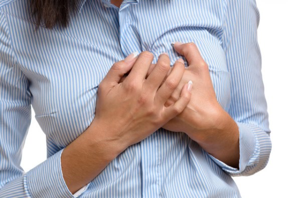 Woman clutching her breast in pain.jpg