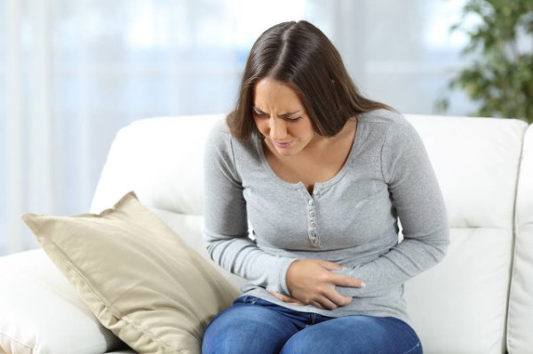 Woman suffering stomach ache.jpg